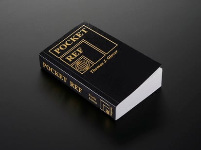 Angled shot of black tome Pocket Ref - 4th Edition - by Thomas J. Glover.