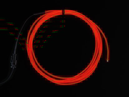 Coil of lit EL wire in red