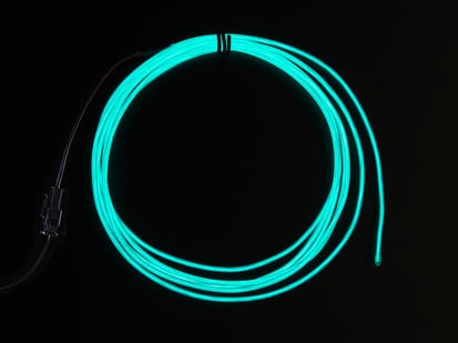 Coil of lit EL wire in aqua