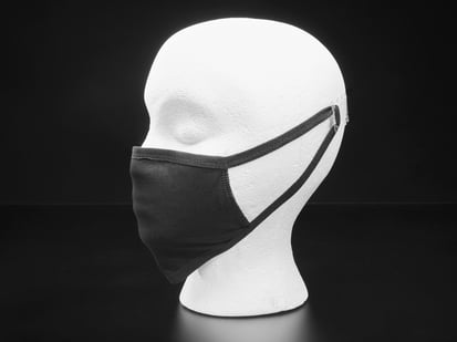 Black cloth face mask shown on a mannequin
