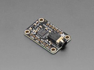 Angled shot of black, rectangular breakout board with audio jack.