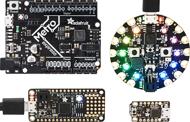 Top view of an Adafruit Metro, Circuit Playground, Feather, and Trinket