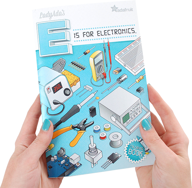 Two hands holding LadyAda's E is for Electronics Coloring Book by Adafruit